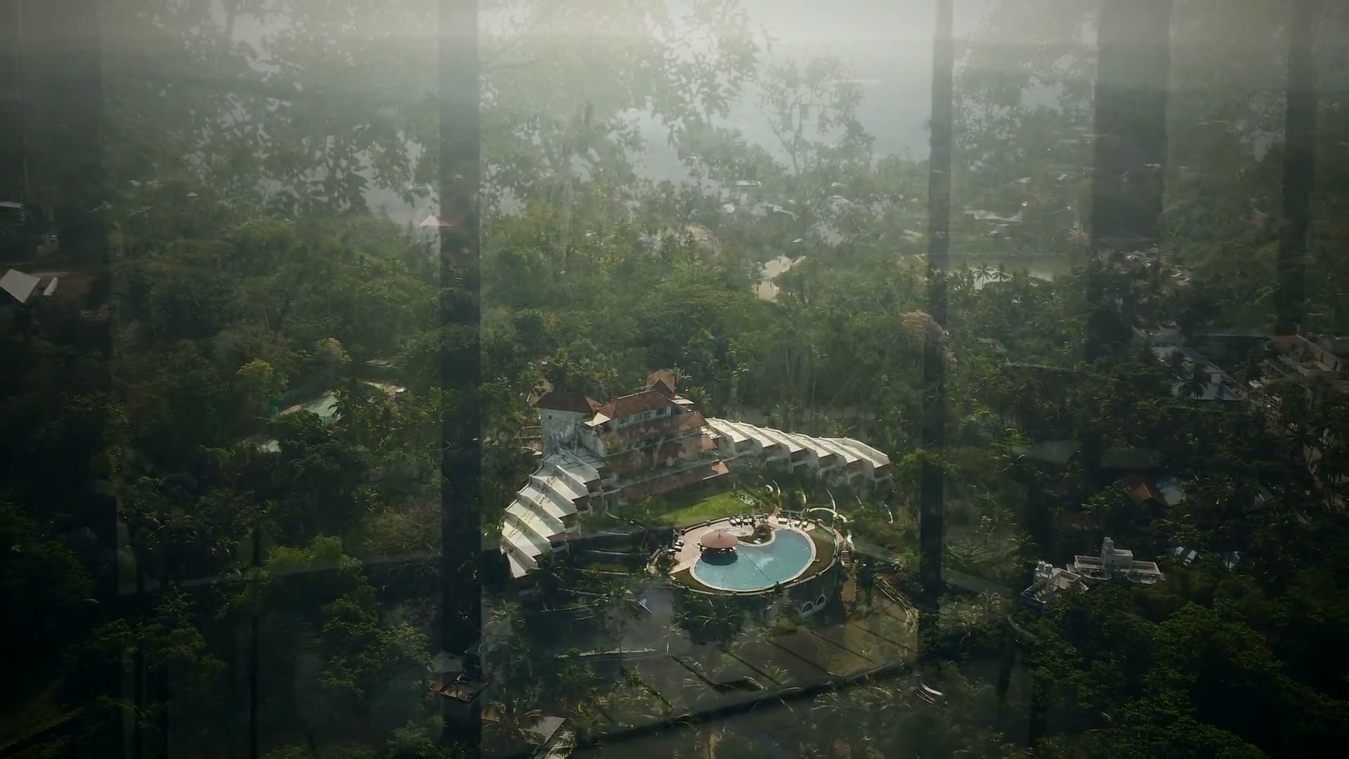 The bungalows in their own clearing on the estate at dusk.